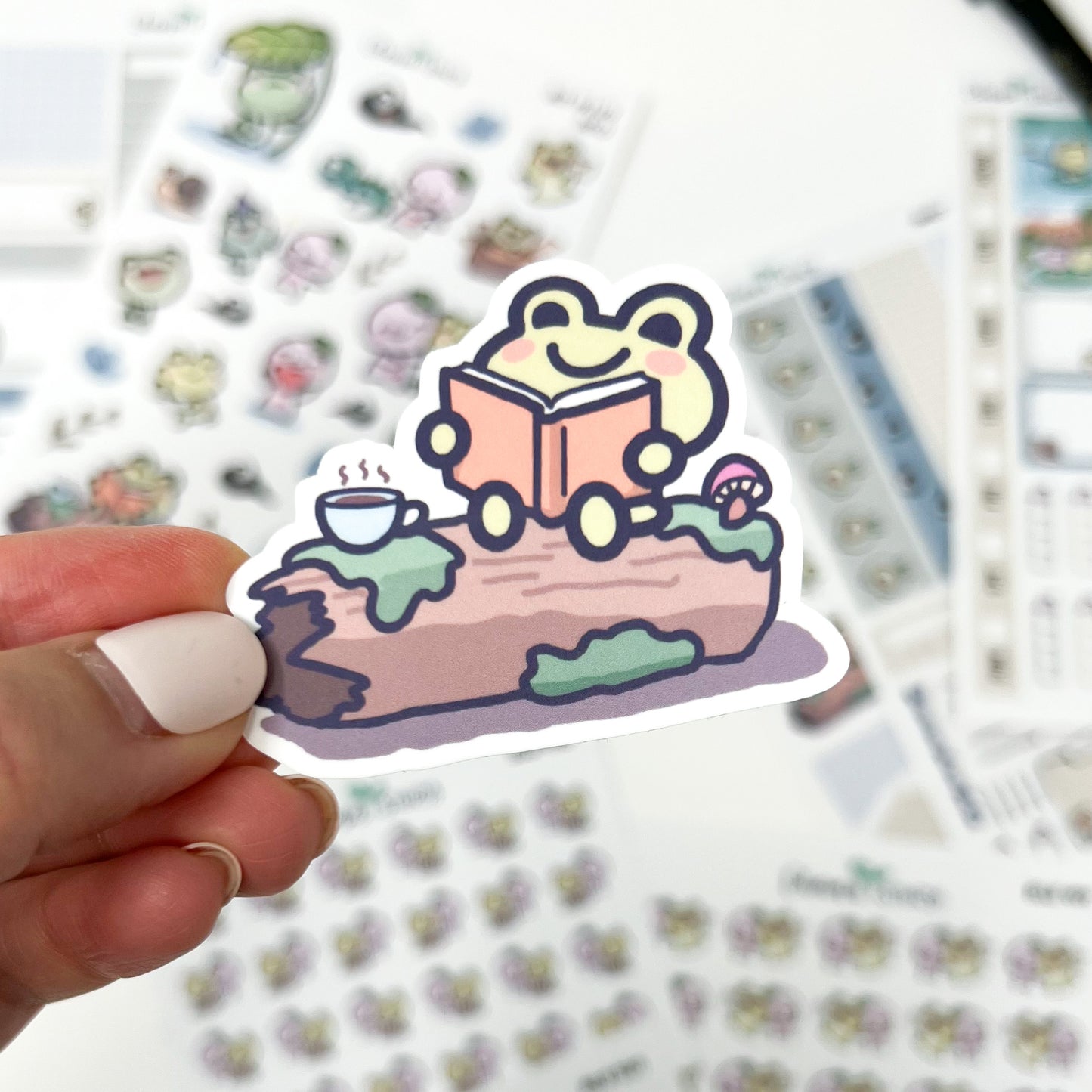 D033 | Froggo Reading on a Log Vinyl Waterproof Die Cut Sticker | Froggo Friends